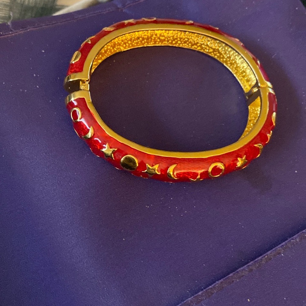 KJL bangle bracelet Fits small wrist in red and gold Has click in Clasp